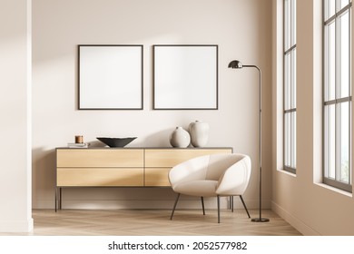 Two Empty Square Frames On Light Pink Wall In Living Room Interior With Sideboard, Single Armchair And Parquet Flooring. Concept Of Modern Design With Mockup Canvas. 3d Rendering