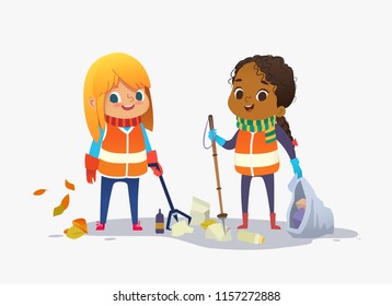 Two girls wearing unoform collect rubbish for recycling at park. Kids gathering plastic bottles and garbage for recycling. Boy throws litter into bin. Early childhood education. Isolated. - Powered by Shutterstock