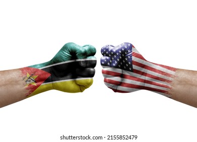 Two Hands Punch To Each Others On White Background. Country Flags Painted Fists, Conflict Crisis Concept Between Mozambique And Usa