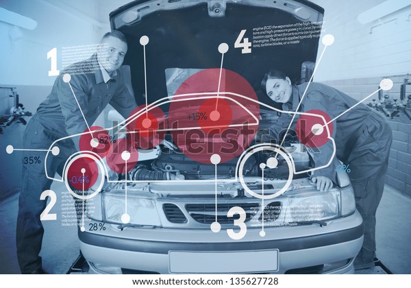 Two happy mechanics consulting futuristic\
interface with car diagram and\
statistics