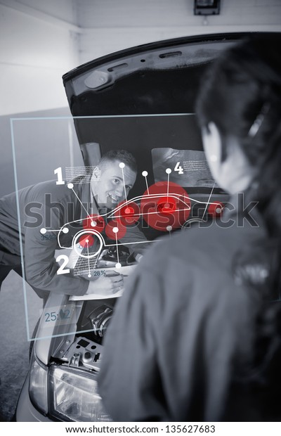 Two mechanics looking at futuristic interface\
with car diagram in black and\
white