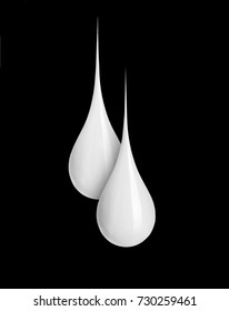 Two milk drops close-up isolated on black background