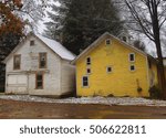 two rustic homes depiction