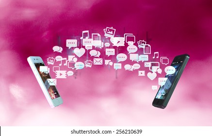 Two smart phones exchanging messages and multimedial content visualized by icon flow - Powered by Shutterstock