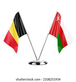 Two table flags isolated on white background 3d illustration, belgium and oman