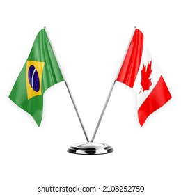 Two table flags isolated on white background 3d illustration, brazil and canada