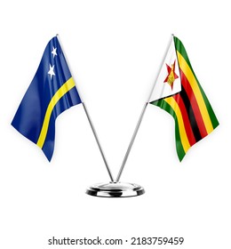 Two table flags isolated on white background 3d illustration, curacao and zimbabwe