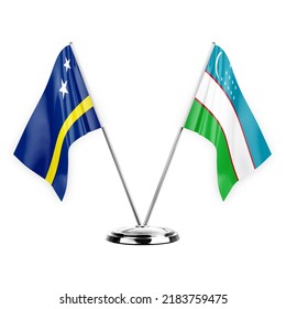 Two table flags isolated on white background 3d illustration, curacao and uzbekistan