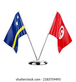 Two table flags isolated on white background 3d illustration, curacao and tunisia
