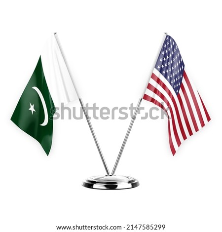 Two table flags isolated on white background 3d illustration, pakistan and usa
