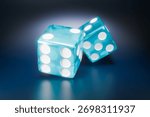 Two translucent blue dice are resting on a dark, reflective surface. 3D Illustration