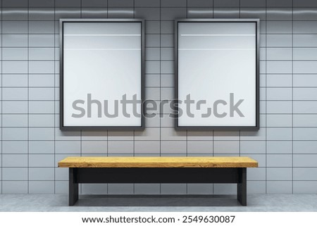 Two vertical blank posters with black frames on a tiled wall in a modern interior. A wooden bench is placed below. Empty space for advertising. 3D Rendering.