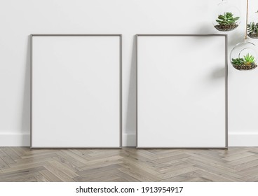 Two Vertical Metal Frame Mockup. Double Metal Frame On Wooden Floor With White Wall And Plants. 3D Illustration