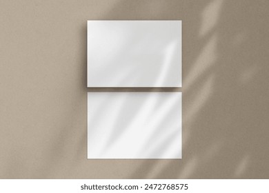 Two white horizontal paper sheets mockup, A4 A5 A6 flyer mockup, paper, letter, invitation card, on a beige background with a botanical shadow overlay.