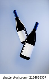 Two Wine Bottles Mockup On Blue Background 3d Rendering. 3D Illustration