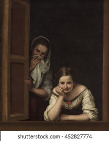 Two Women At A Window, By Bartolome Esteban Murillo, 1655-60, Spanish Painting, Oil On Canvas. A Young Woman Peering From Her Window, With An Older Woman, In The Shadows Beside Her. Perhaps It Depict