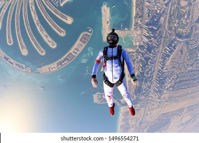 UAE Dubai Skydive Over Palm . Man Fly Over Dubai City.  Skydiving In UAE. Skydiving And Palm Jumeirah