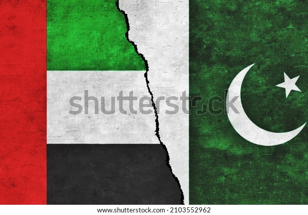 UAE and Pakistan painted flags on a wall with a\
crack. Pakistan and United Arab Emirates relations. UAE and\
Pakistan flags\
together
