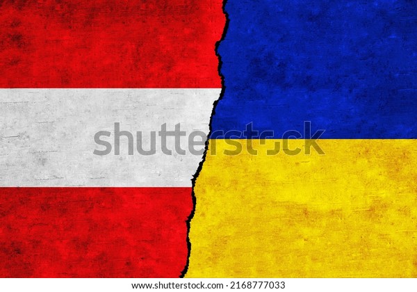 Ukraine and Austria painted flags on a wall with\
a crack. Ukraine and Austria relations. Austria and Ukraine flags\
together