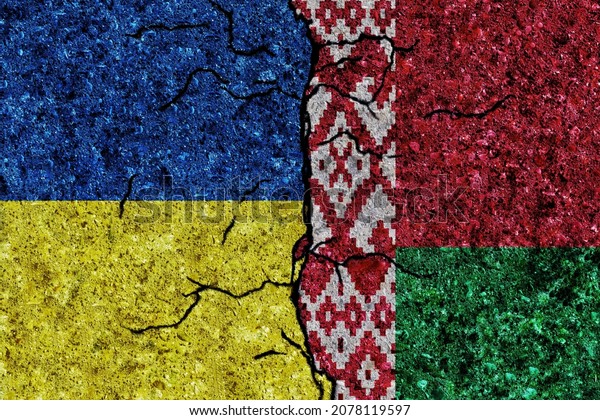 Ukraine and Belarus painted flags on a wall with\
grunge texture. Ukraine-Belarus conflict. Ukraine and Belarus flags\
together