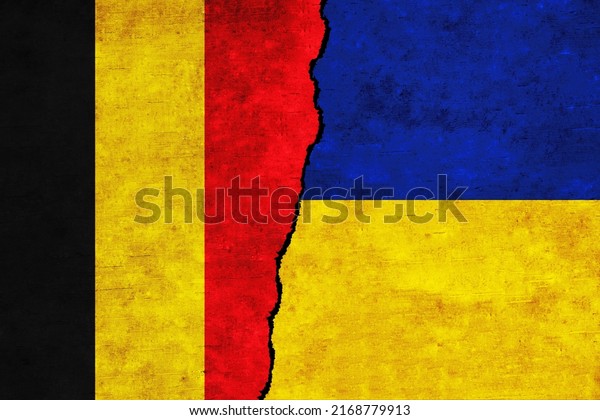 Ukraine and Belgium painted flags on a wall with\
a crack. Ukraine and Belgium relations. Belgium and Ukraine flags\
together