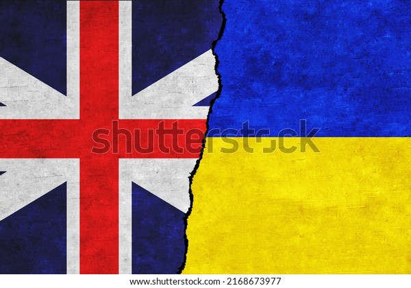 Ukraine and Britain painted flags on a wall with\
a crack. Ukraine and Great Britain relations. Great Britain and\
Ukraine flags\
together