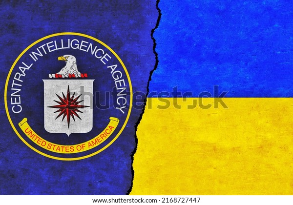 Ukraine and CIA painted flags on a wall with a\
crack. Ukraine and CIA relations. US Central Intelligence Agency\
and Ukraine flags\
together