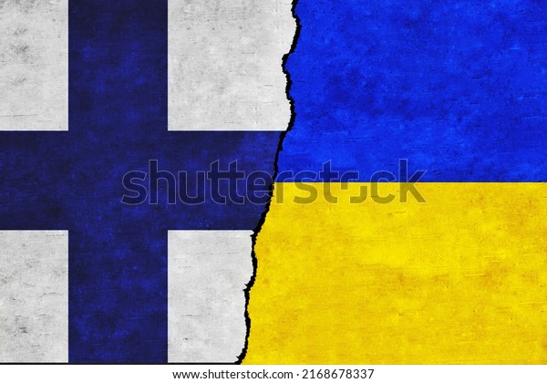 Ukraine and Finland painted flags on a wall with\
a crack. Ukraine and Finland relations. Finland and Ukraine flags\
together