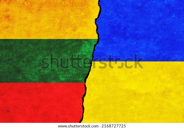 Ukraine and Lithuania painted flags on a wall\
with a crack. Ukraine and Lithuania relations. Lithuania and\
Ukraine flags\
together