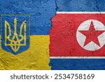 Ukraine and North Korea flags  - Cracked concrete wall painted with a Ukrainian flag on the left and a North Korean flag on the right