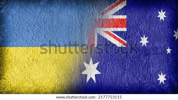 Ukrainian and Australian flag on concrete, divided\
in the middle