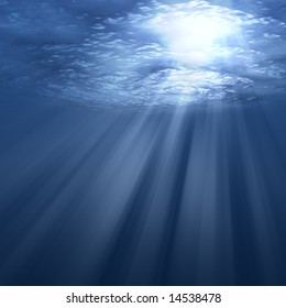 Underwater Scene With Sun Rays Shining Through Water Surface.