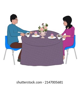 An unhappy couple is having their teatime.