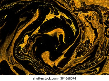 Unique handmade texture. Abstract decorative texture. Golden and black mixed paints.