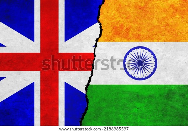 United Kingdom and India painted flags on a wall\
with a crack. India and Great Britain relations. UK and India flags\
together