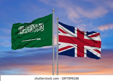 United Kingdom And Saudi Arabia Flags Waving In The Wind As Sign Of Cooperation Or Diplomatic Meeting Event. 3d Illustration

