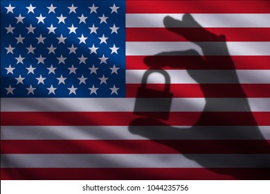 United States Of America
 Closed Lock In The Hand. Import And Export Of Goods From The World Market Of Trade Is Prohibited. Closed Borders For Tourists And Immigrants. Epidemic Virus