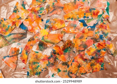 Unusual patterns from torn pieces of painted wet paper, in the artist's studio. Abstract background for your creative design or illustrations. - Powered by Shutterstock