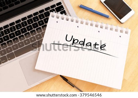 Update - handwritten text in a notebook on a desk - 3d render illustration.