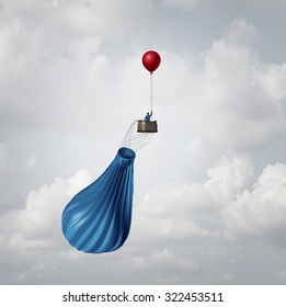 Urgency business plan and crisis management strategy metaphor as a businessman in a broken deflated hot air balloon being saved by a single small balloon as an innovative response solution idea. - Powered by Shutterstock