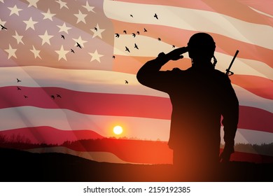 USA Army Soldier Saluting On A Background Of Sunset Or Sunrise And USA Flag. Greeting Card For Veterans Day, Memorial Day, Independence Day. America Celebration. 3D-rendering.