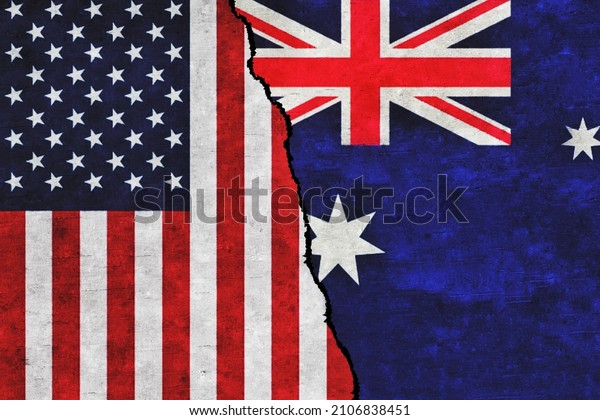 USA and Australia\
painted flags on a wall with a crack. United States of America and\
Australia relations