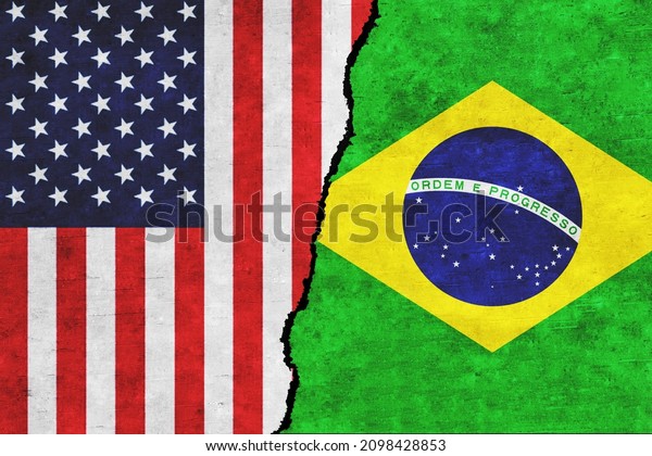 USA and Brazil painted flags on a wall with a\
crack. USA and Brazil relations. Brazil and United States of\
America flags together. USA vs\
Brazil