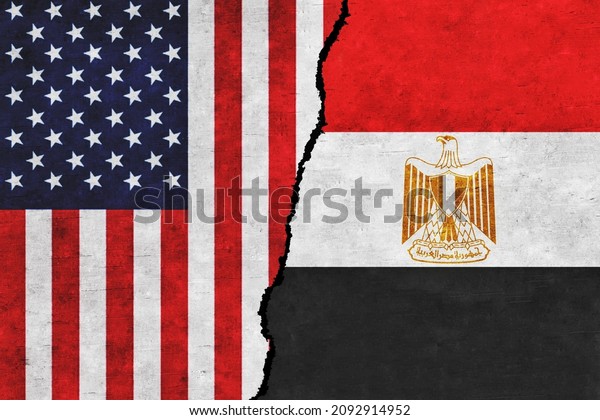 USA and Egypt painted flags on a wall with a\
crack. USA and Egypt relations. Egypt and United States of America\
flags together. USA vs\
Egypt