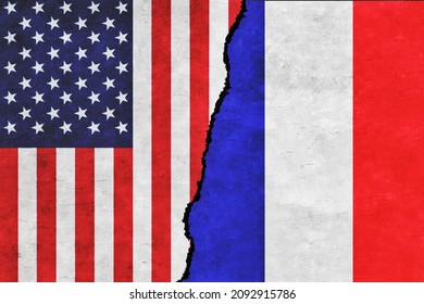 USA and France painted flags on a wall with a crack. USA and France relations. France and United States of America flags together. USA vs France