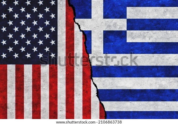USA and Greece painted flags\
on a wall with a crack. United States of America and Greece\
relations