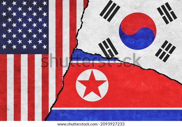 USA, North Korea and South Korea painted flags\
on a wall with a crack. United States of America, South Korea and\
North Korea\
relations