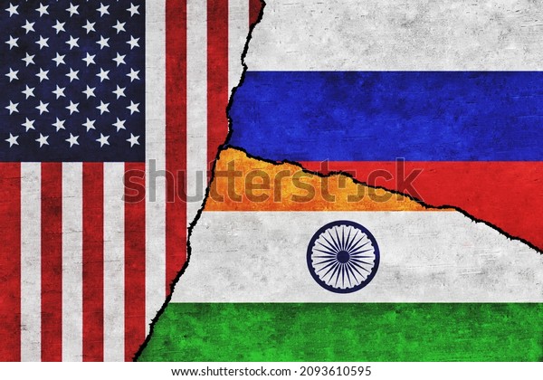USA, Russia\
and India painted flags on a wall with a crack. United States of\
America, India and Russia\
relations