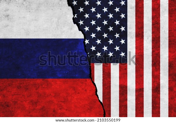 USA and Russia painted flags on a wall with a\
crack. Russia and United States of America relations. USA and\
Russia flags\
together