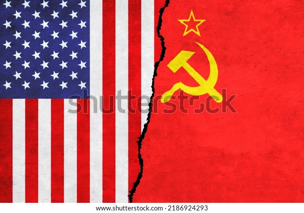 USA and Soviet Union painted flags on a\
wall with a crack. United States of America and Soviet Union\
relations. Soviet Union and USA flags\
together
